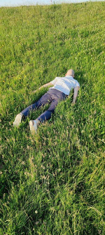 Me, laying in grass face down, looking like the cover of Porter Robinson's Nurture