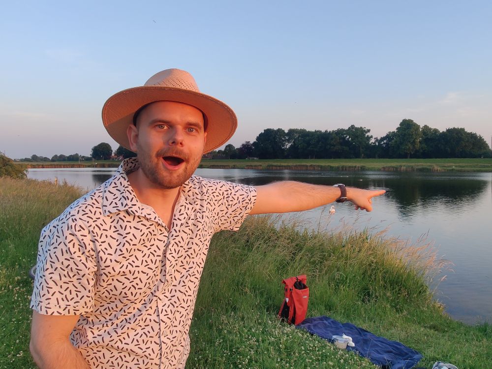 Also pointing at water but this time while looking at the camera with my mouth open wide.