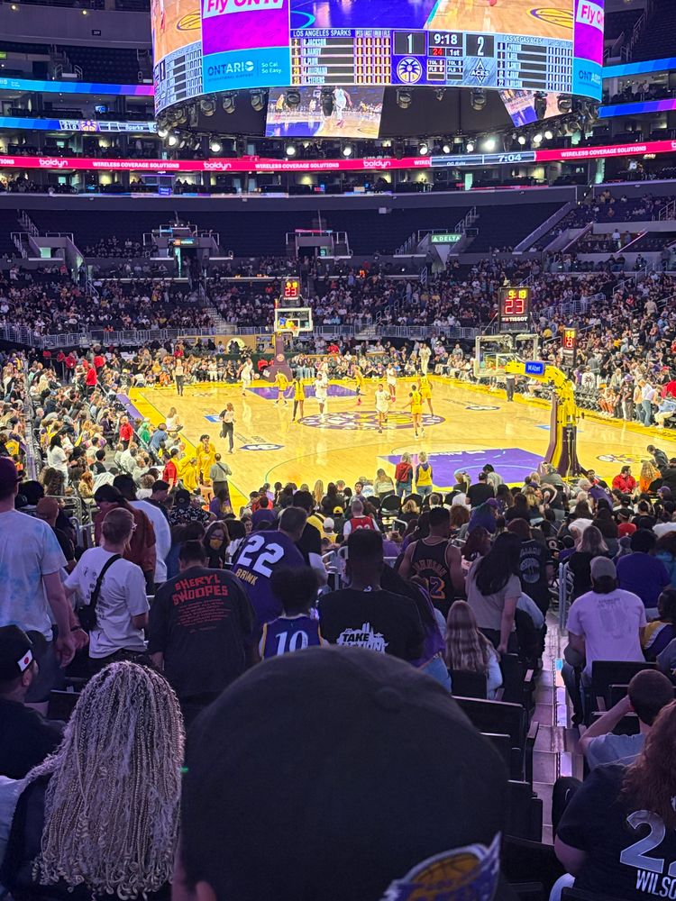 Sparks basketball court at Staples Center.  Lower bowl shot, cross in front and teams on the court with the Aces leading the Sparks 2-1 on the scoreboard 