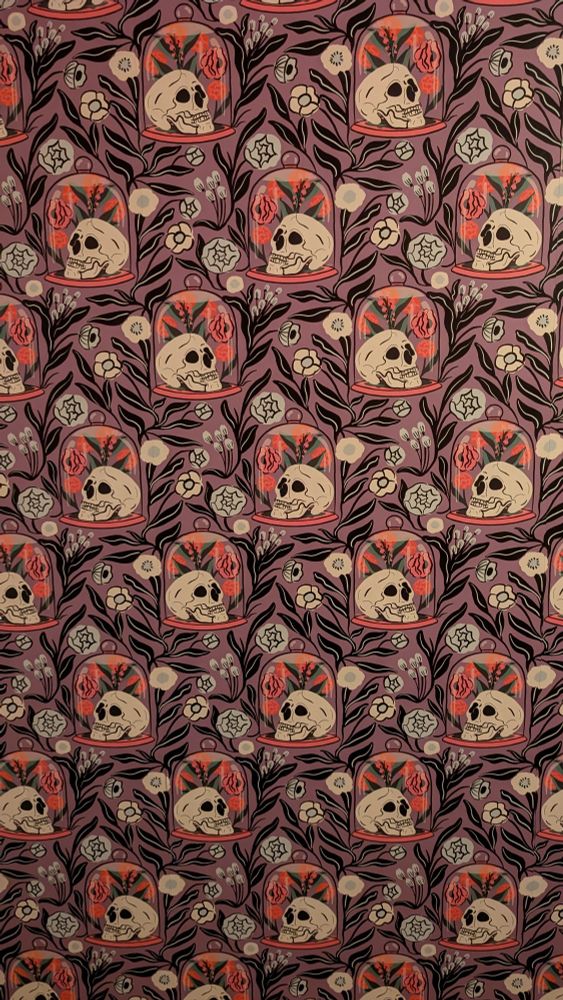 a wallpaper featuring flowers and skulls in a glass case 