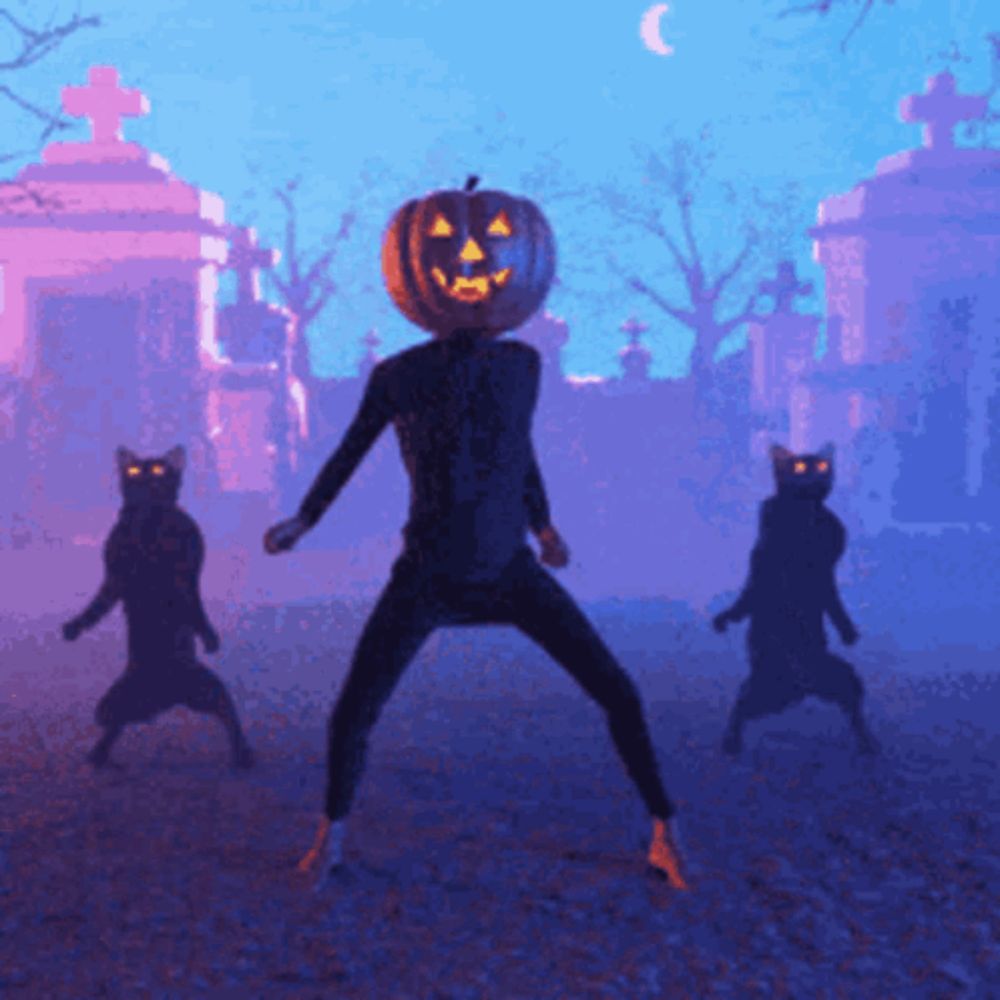 a man with a pumpkin on his head is surrounded by cats