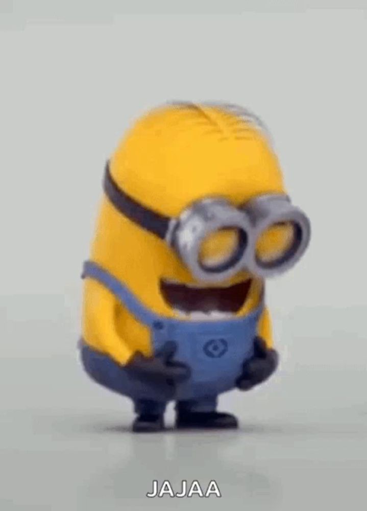 a cartoon minion wearing goggles and overalls is smiling and laughing .