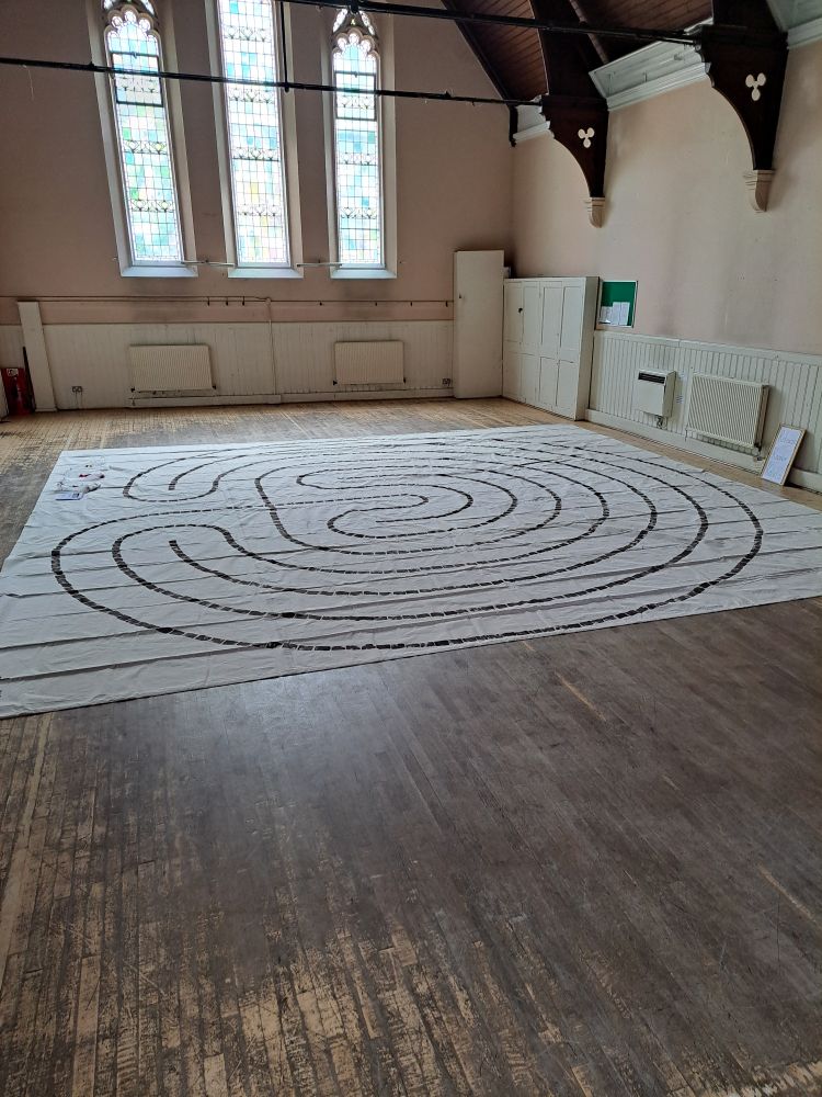 Very large fabric labyrinth laid out in a church hall