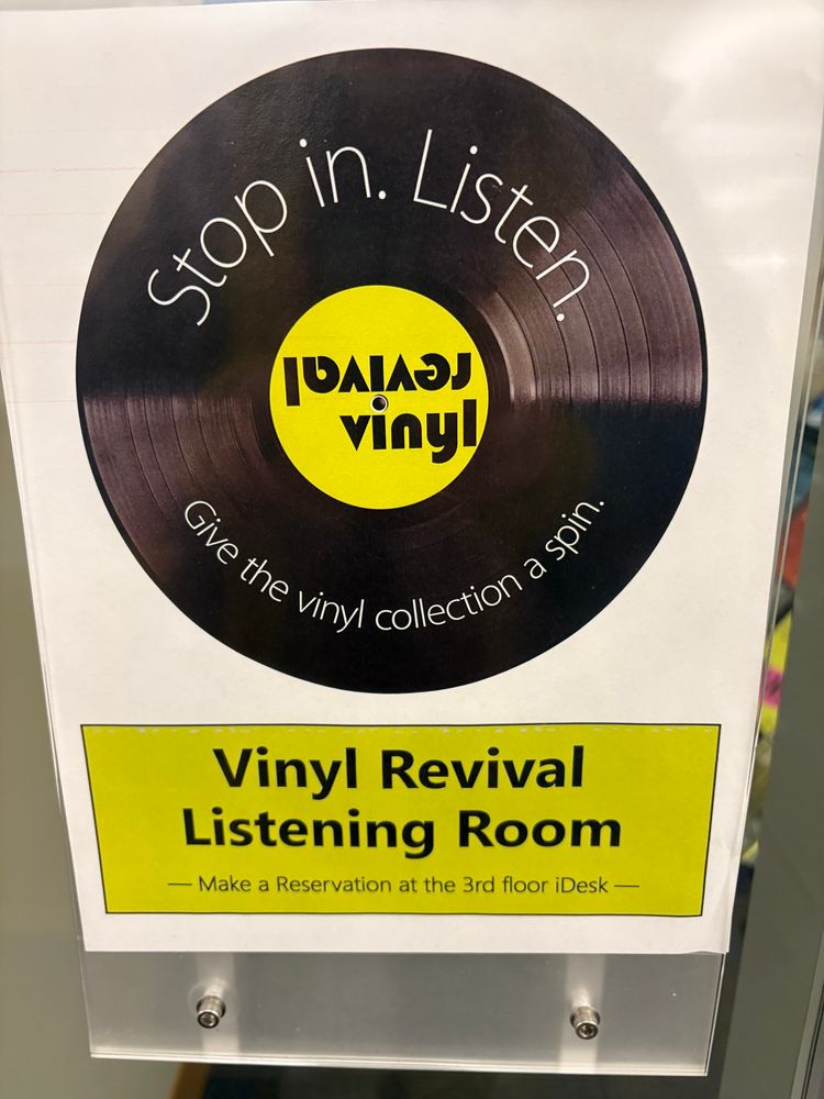 Sign with LP picture: Vinyl Revival Listening Room