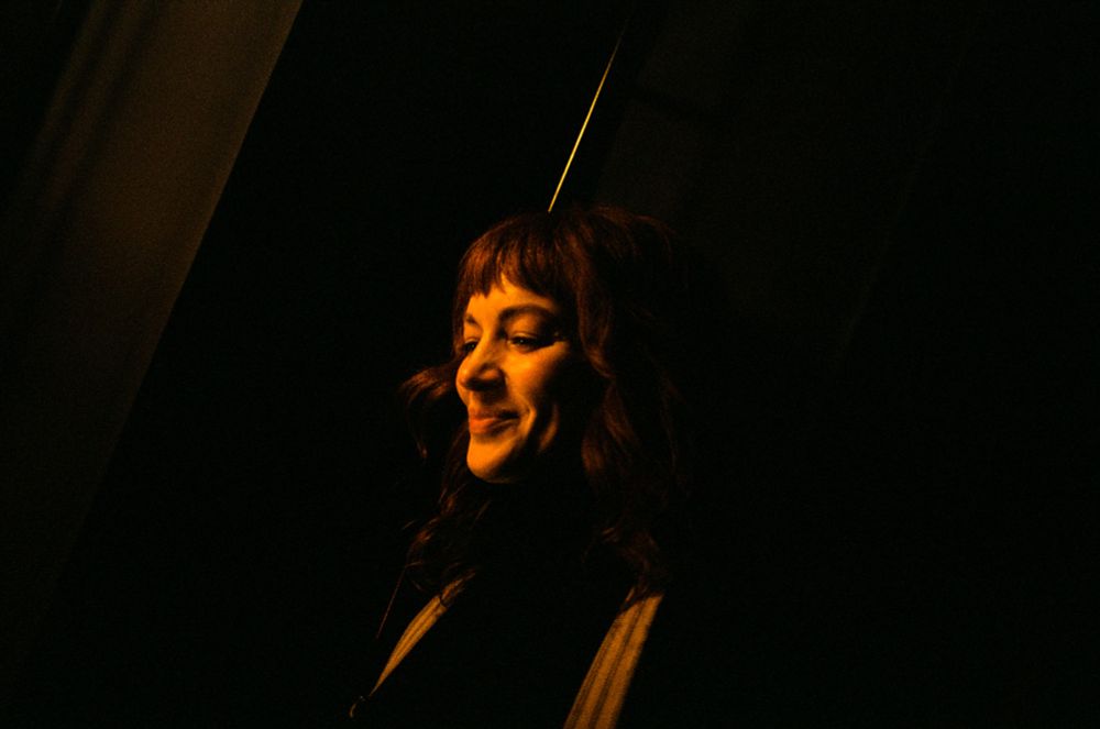 Britt Lower in tent smiling 