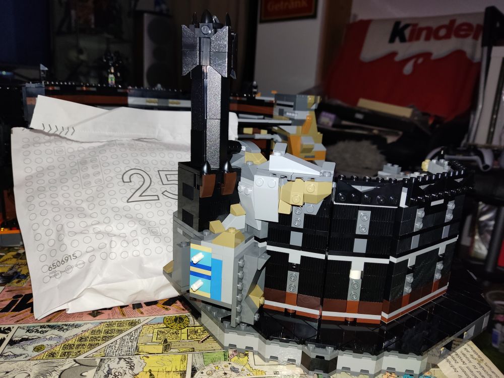 A small spire on the left (out)side of the first floor. It's completely black. 