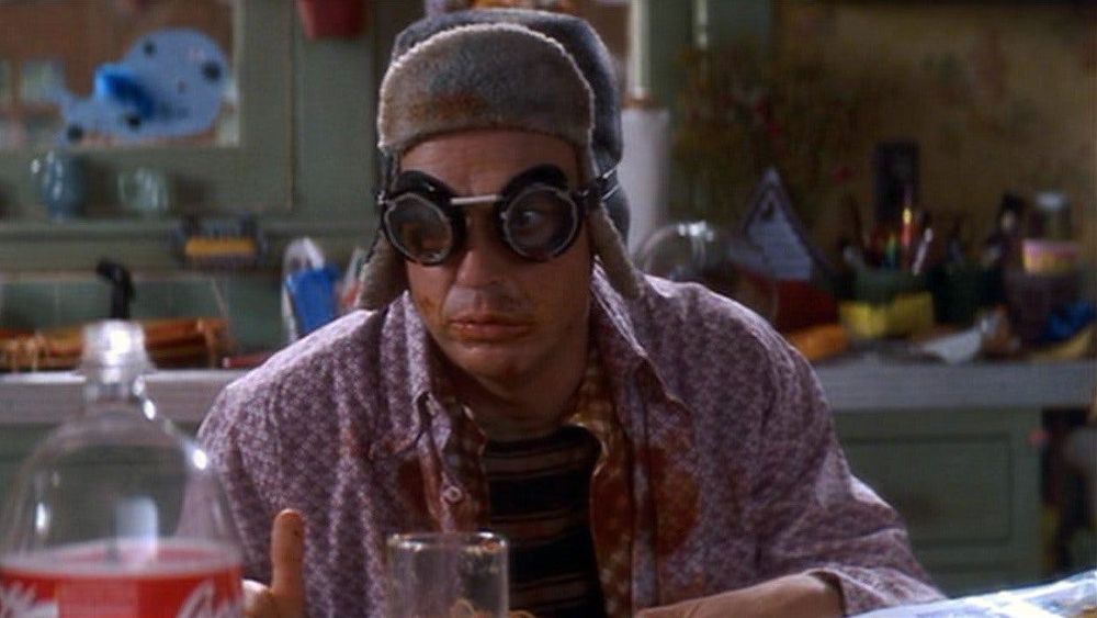 Michael Keaton in the movie Multiplicity, dressed in a silly hat and goggles. He is the clone of his clone, and this character is silly and dumb