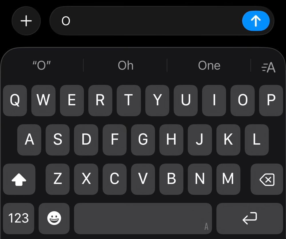 iOS 26 keyboard in iMessage. The keyboard letters are all capital, and a capital O is in the text box. The font of the text box does not appear to match the font of the keyboard.