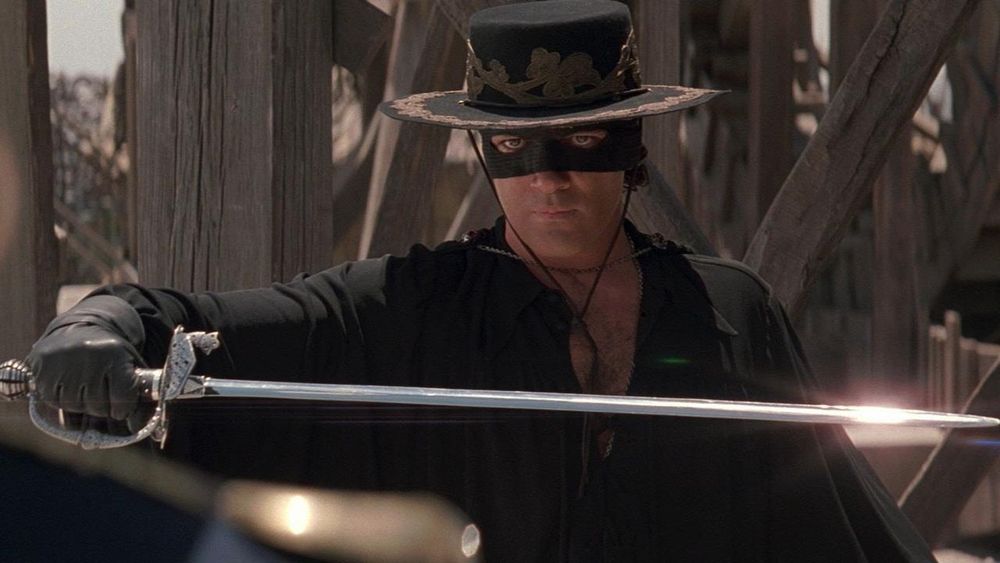 Screencap of the movie with Zorro drawing his sword.