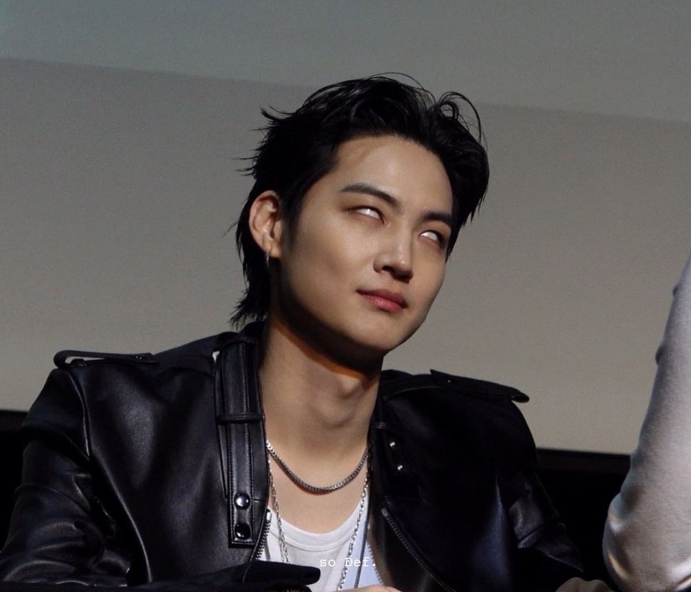 JB from GOT7 wearing a leather jacket and rolling his eyes dramatically. 