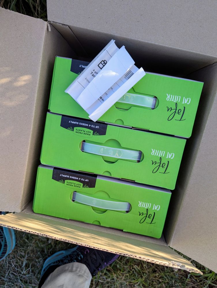Three green boxes of tofu cat litter, in an Amazon box.