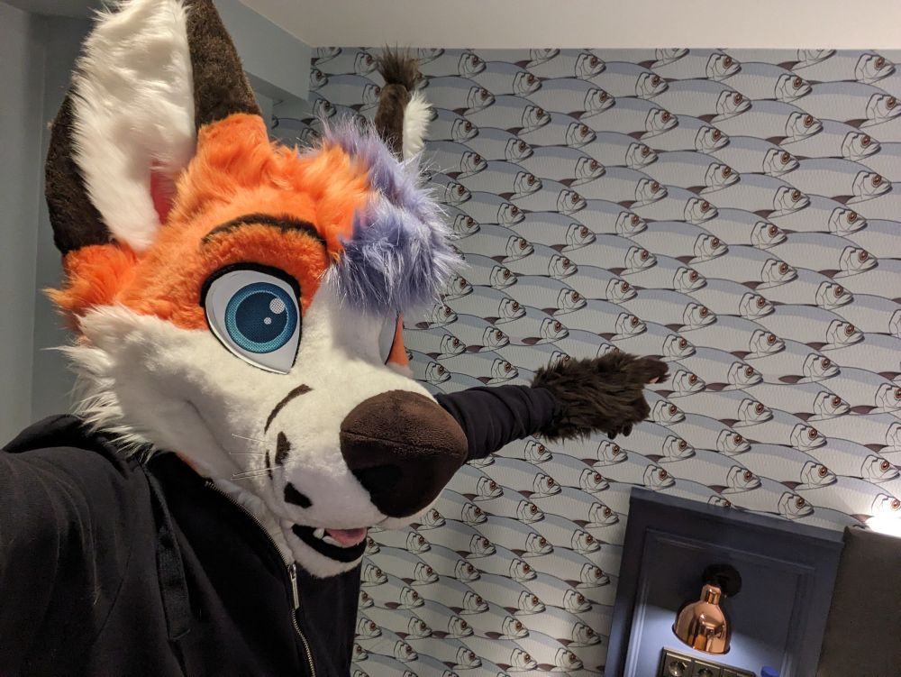 Fox painting at wall with fish