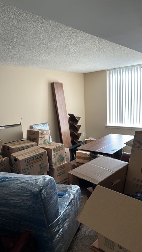 Boxes and furniture waiting to be unpacked.
