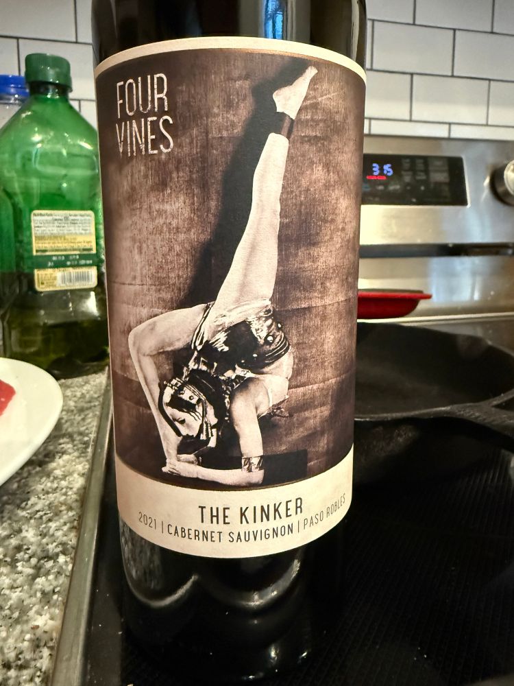 A bottle of Cabernet with a contortionist on the label. The wine is named The Kinker.