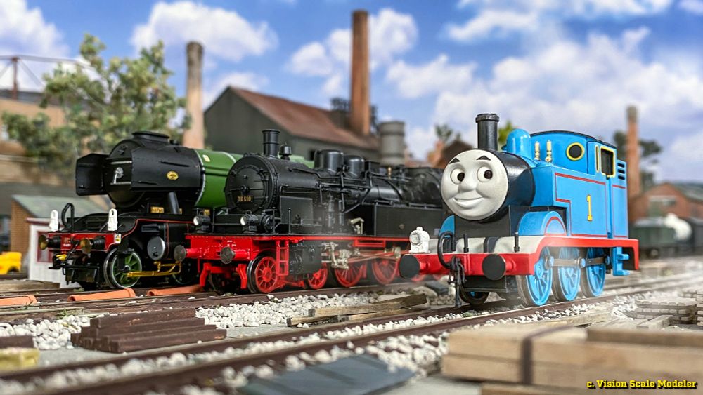 Standing proud in the yard is a Hornby Flying Scotsman, a Fleischmann BR 78 tank loco of the DRG, and a customized Bachmann USA Thomas with a resin printed face designed by @cooldude7208 and @Thomasmodelerfan96 on Twitter