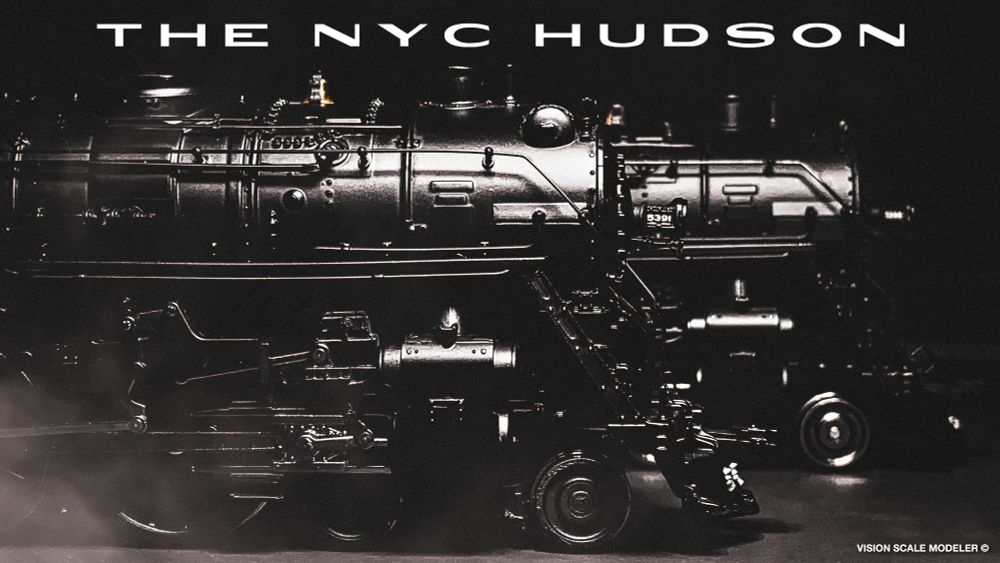 Two Broadway Limited HO Hudson locomotives on the modeling desk, under studio lighting to showcase the detail and shiny paintwork before weathering.
