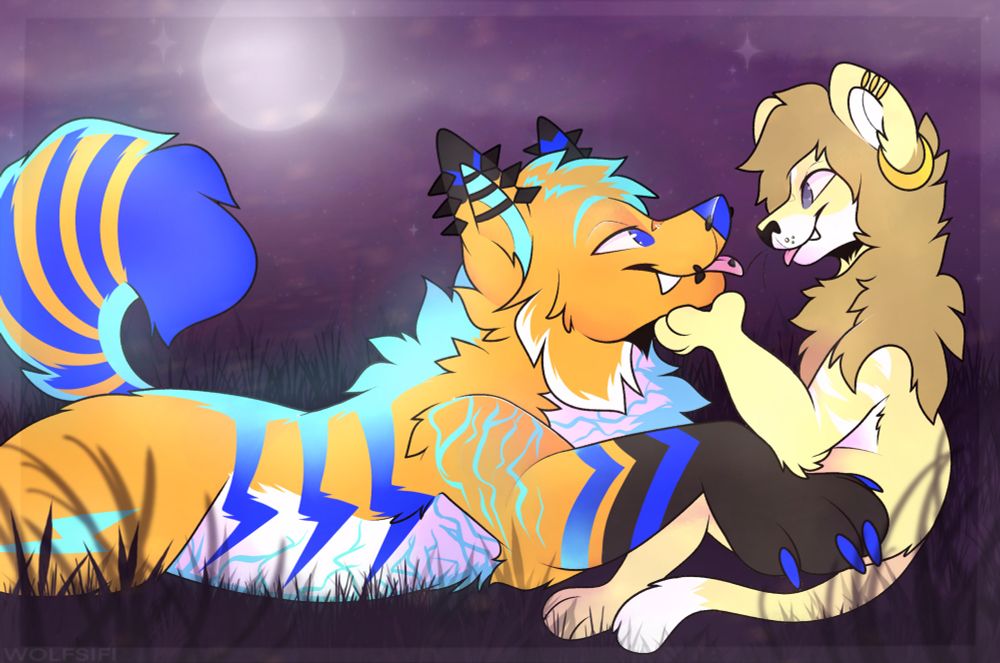 Amina (lion) sitting while Sparky (fox) rests facing the lion.