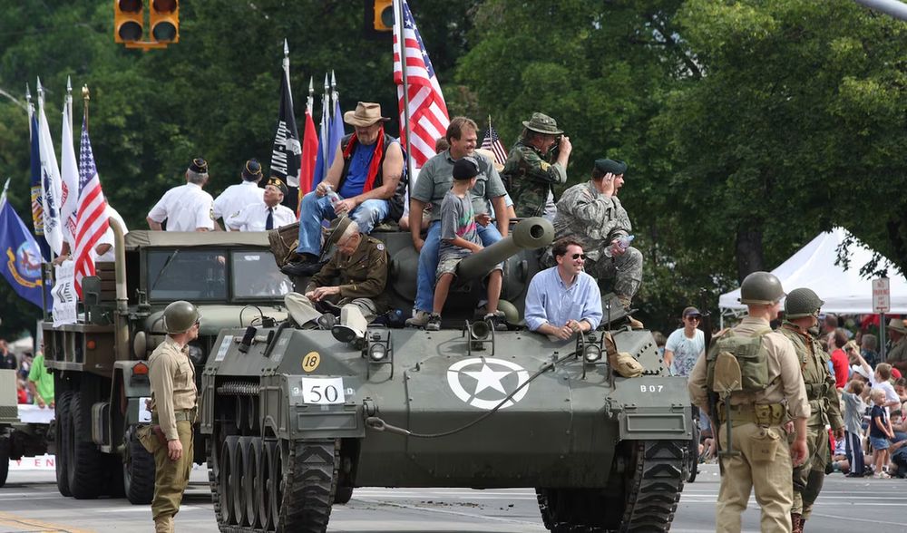 Josh Coates driving a tank. 