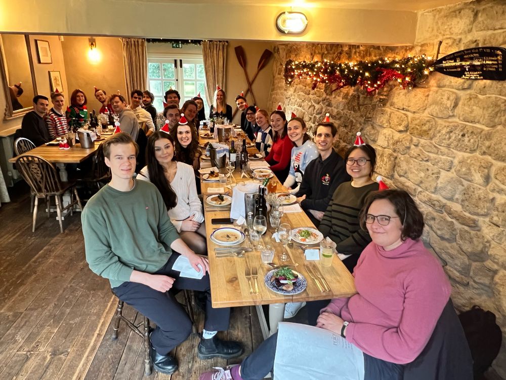 The Williams group say around two tables on a stone walled pub.