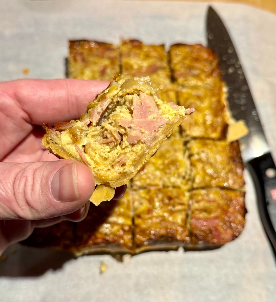 i’m holding a square of quiche