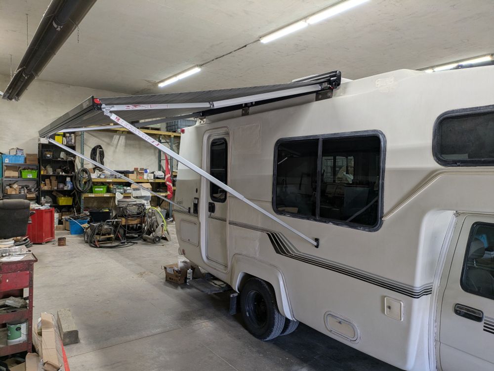 1990 Toyota sunrader with awning extended.