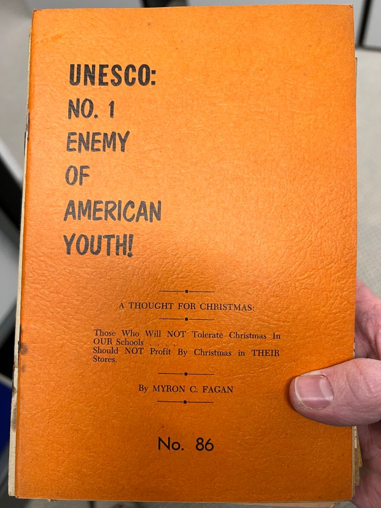 Booklet entitled, “UNESCO : No. 1 Enemy of American Youth!: A Thought for Christmas.” It then reads, “Those who will NOT Tolerate Christmas in OUR Schools Should NOT Profit By Christmas in THEIR Stores.” 
By Myron C Fagan. 