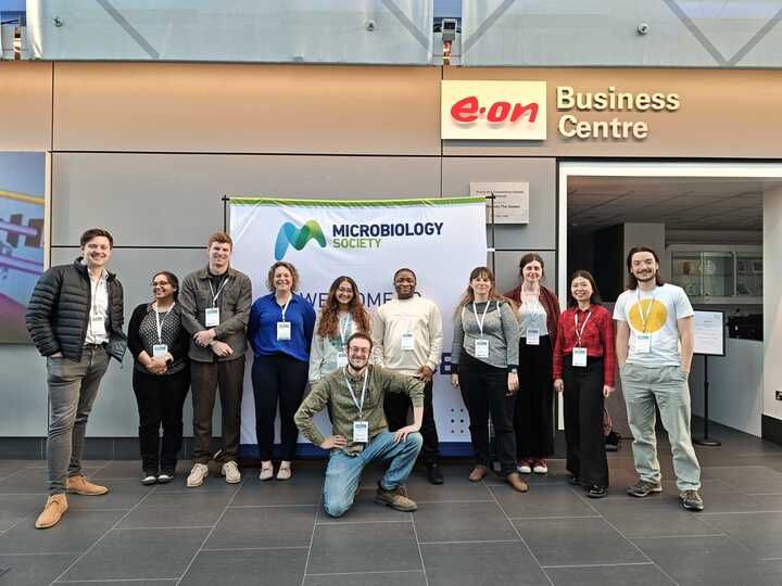 Researchers from the Manchester Microbial Evolution Research group pose for a photo at the Microbiology Society Conference 2025