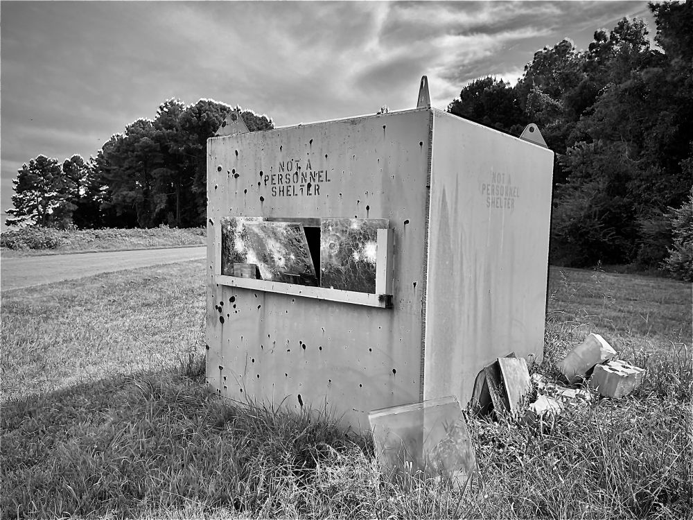 Testing safety bunker with thick glass inserts (with ballistic holes).
