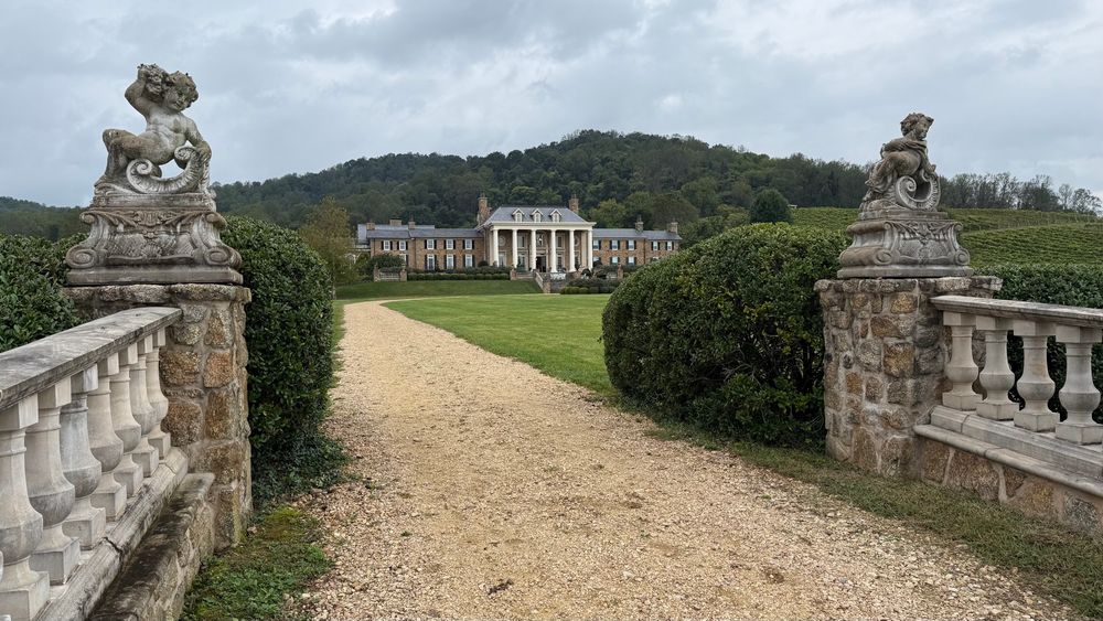 The main house is massive and looks like an English or French chateau with large pillars and symmetric rectangular shape. Fun fact- the buildings on the property are heated by 34x ~100m deep geothermal wells.