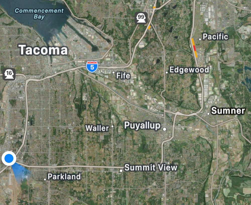a screen shot of a map of the Tacoma area showing a blue dot south of Tacoma and west of Sumner