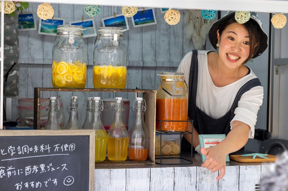 Tokyo, Japan, May 5th, woman selling drinks in a small stall on the Tokyo streets in the Ginza district.

Tokyo, Japan, May 5th, woman selling drinks in a small stall on the Tokyo streets in the Ginza district