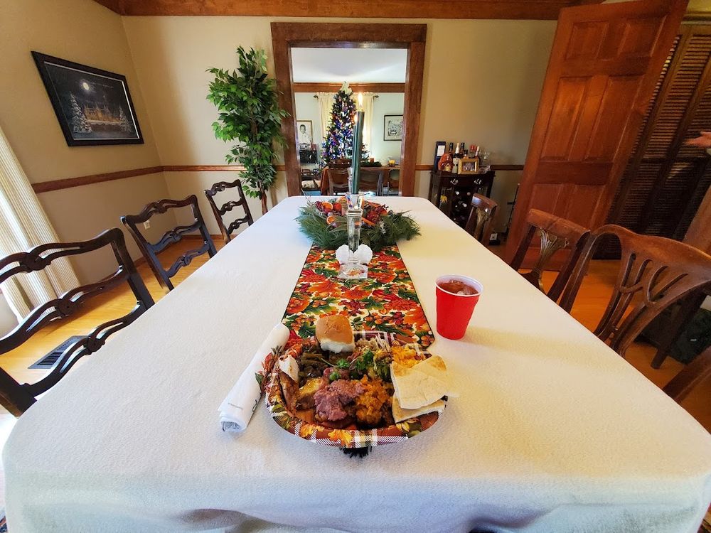 Thanksgiving dinner with Christmas decorations already up.