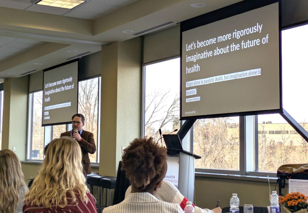 Dr. Sean Park leads Offord Centre Research Day attendees through an interactive session. The slide on his presentation is titled, "Let's become more rigorously imaginative about the future of health". The subtitle reads, "'Rigor alone is paralytic death, but imagination alone is insanity.' - Gregory Bateson".
