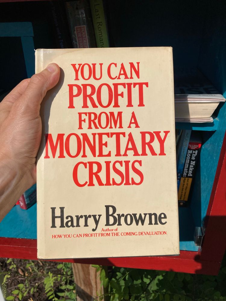old book cover with just text, big red letters YOU CAN PROFIT FROM A MONETARY CRISIS by Harry Browne 