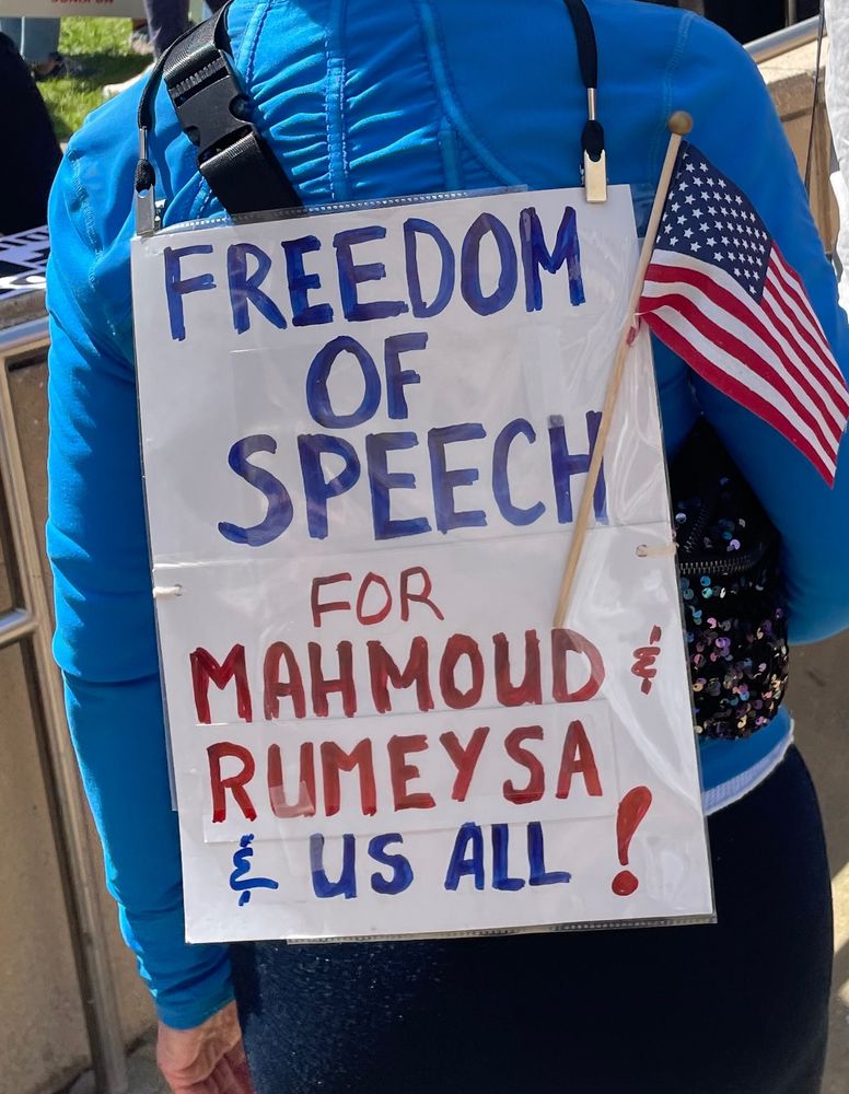 sign reading "freedom of speech for Mahmoud & Rümeysa & us all"