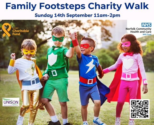 Children wearing superhero outfits and holding hands