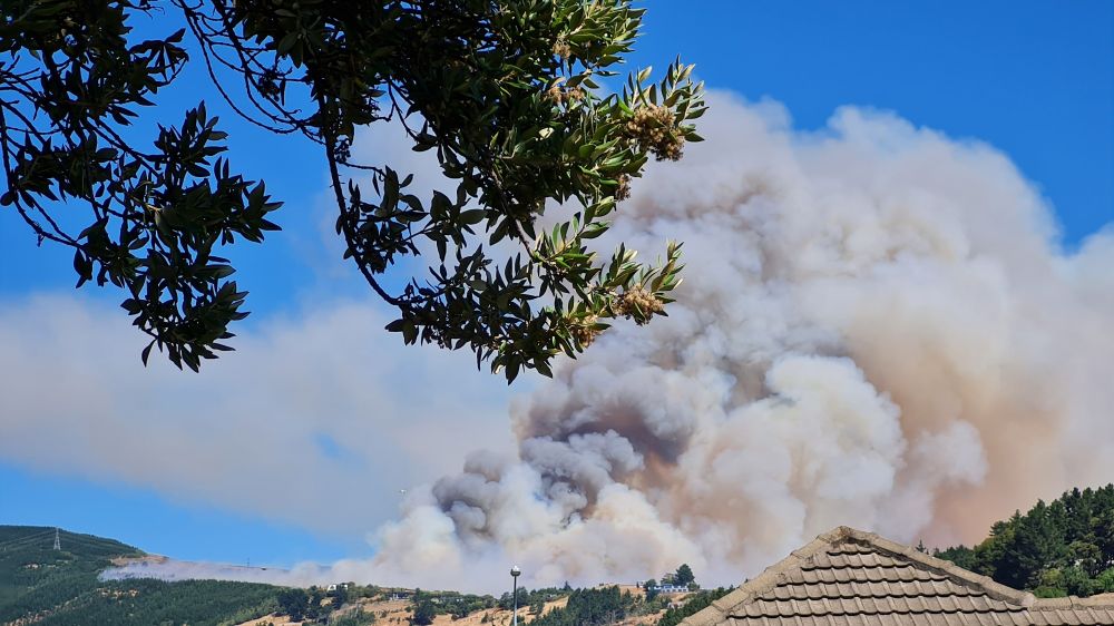 Huge billowing grey and cream fire smoke