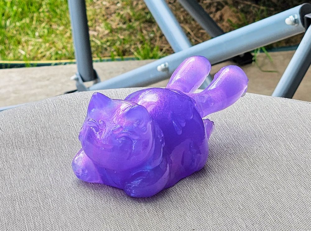 Purple cat shaped squish on a chair 