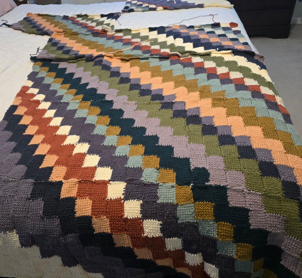 Tunusian crocheted blanket. Patterns of diagonal multi-colored squares. Not yet complete. 