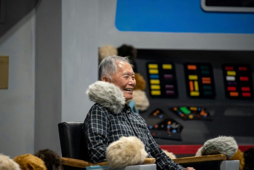 George Takei chilling with Tribbles