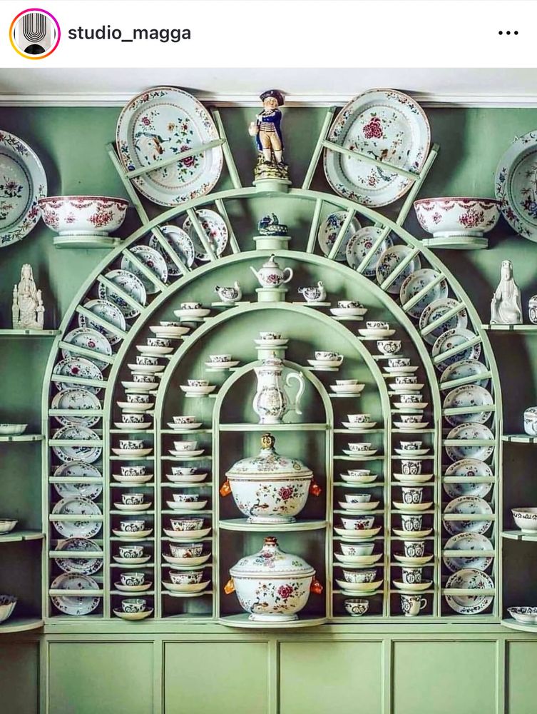 Pale green wood cabinet designed to hold a collection of chinaware/-plants bowls, cups, tureens and figurines. The dishes are of beautiful floral pattern on white background. 

I need to organize cupboards (: