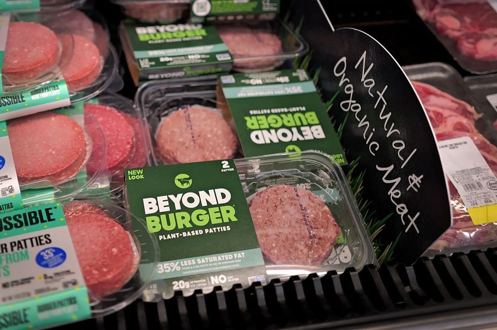 Plant-based burgers made by Beyond Meat and Impossible Foods on display at a grocery store.