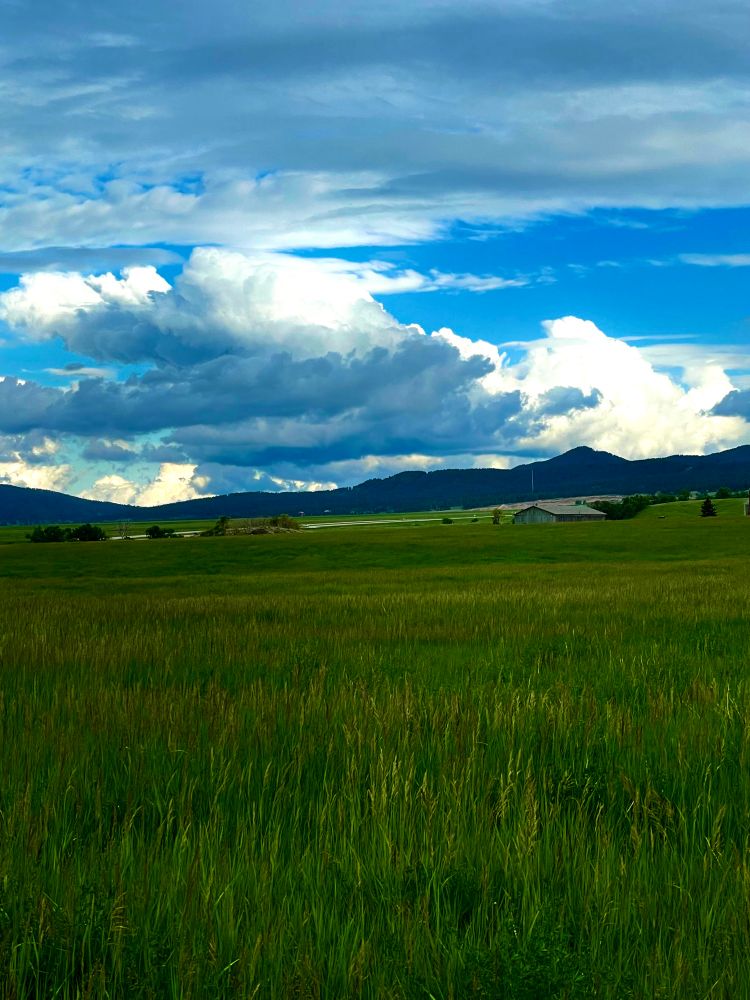 Landscape across South Dakota land with mountains and beautiful clouded sky 