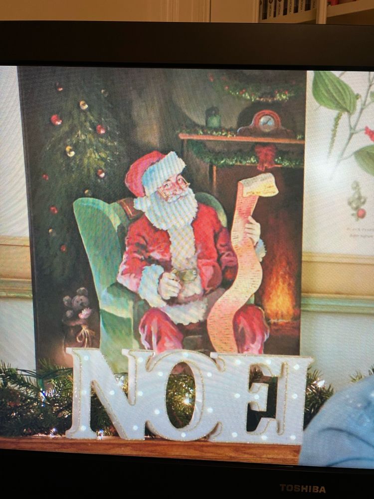 A mediocre painting of Santa checking his list