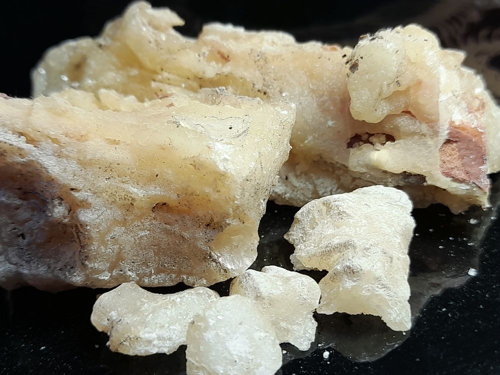 Close up of lumps of blond pine resin