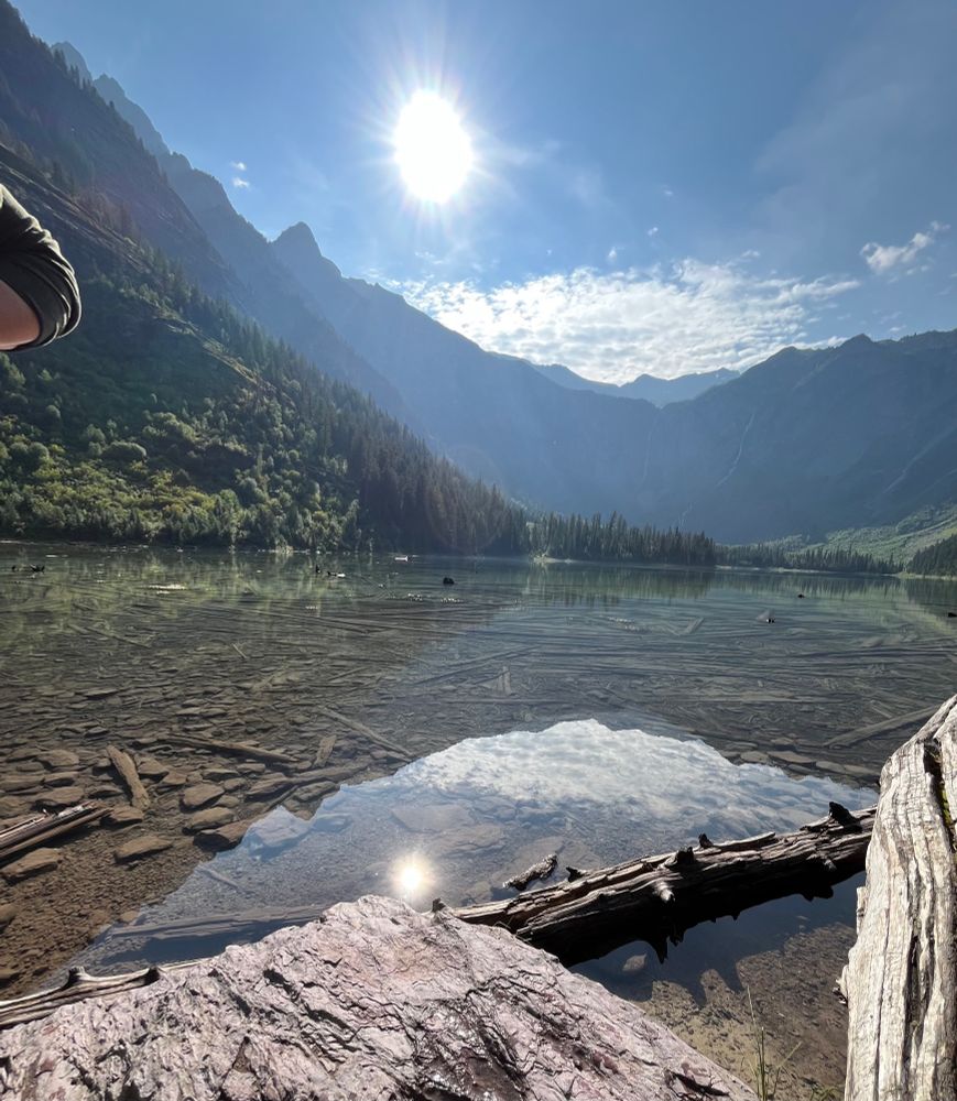 A clear lake surrounded by mountains 