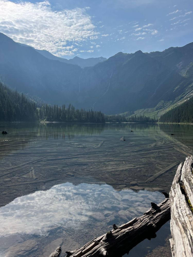 A clear lake surrounded by mountains 
