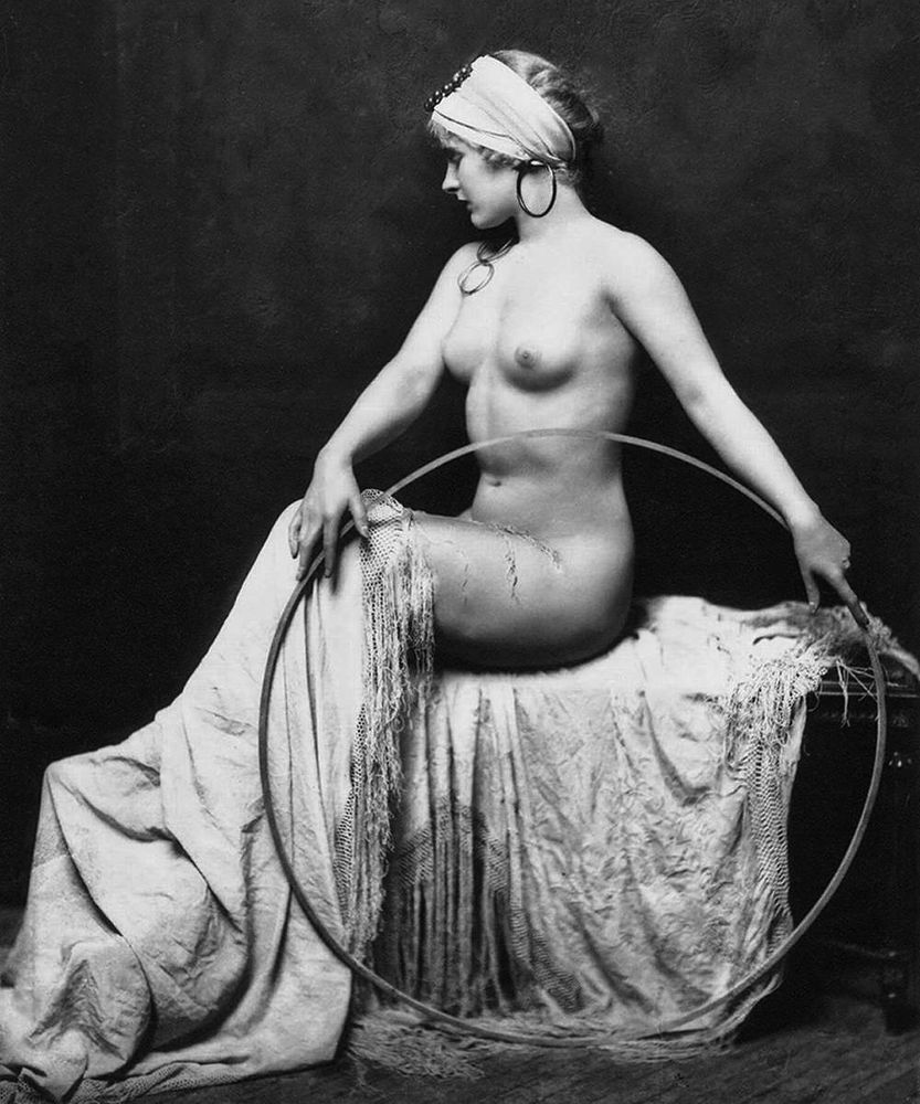 Ziegfeld Follies showgirl posing for a photo with a hoop