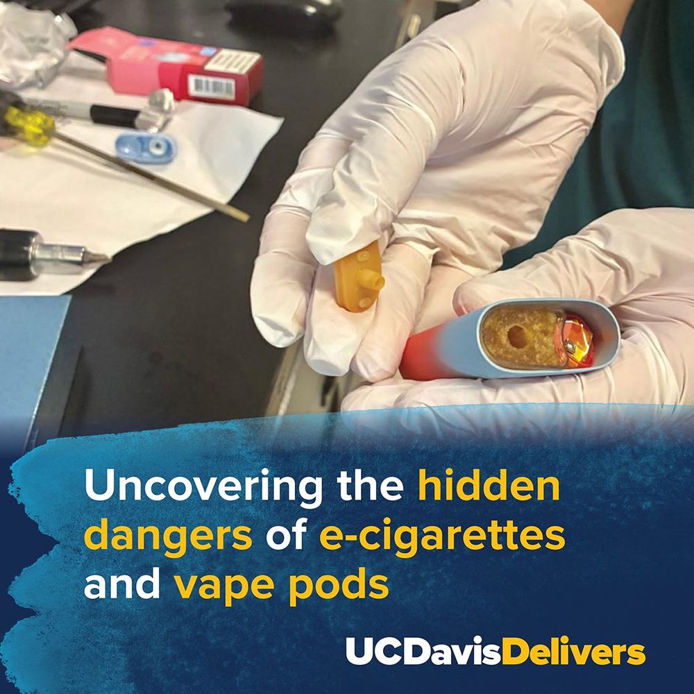A researcher in a lab examines a vial with a yellow substance, related to a study on the dangers of e-cigarettes and vape pods. Text overlay: "Uncovering the hidden dangers of e-cigarettes and vape pods - UC Davis Delivers."