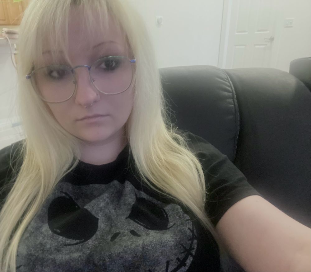 selfie of me with blond hair glasses and a black shirt 